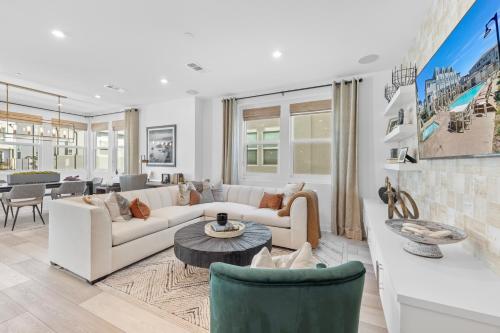 a living room with a couch and a table at #Marbella Lane-Luxury Designer 3BR Home Disneyland in Anaheim