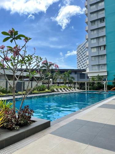 a swimming pool in the middle of a building at Sleek Stay in Bacolod in Bacolod
