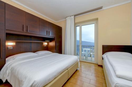 Postel nebo postele na pokoji v ubytování Hotel Bellavista