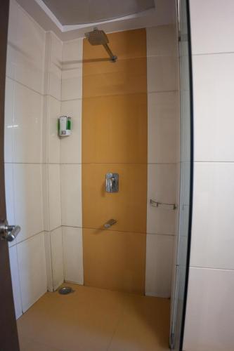 a shower with a glass door in a room at The Shanti A Boutique Hotel in Jodhpur