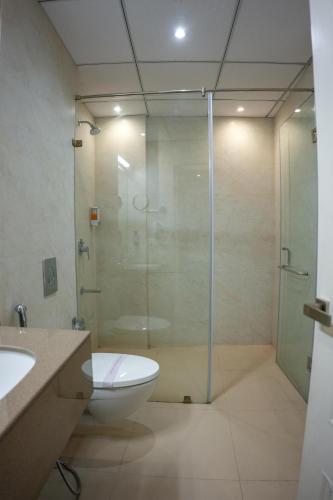 a bathroom with a glass shower and a toilet at The Shanti A Boutique Hotel in Jodhpur