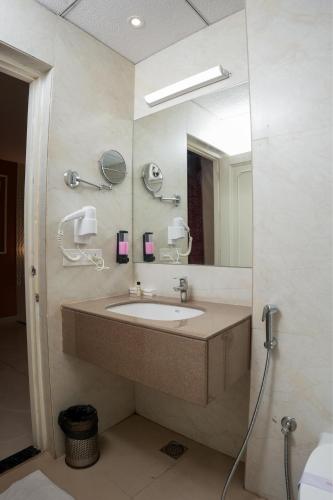 a bathroom with a sink and a mirror at The Shanti A Boutique Hotel in Jodhpur