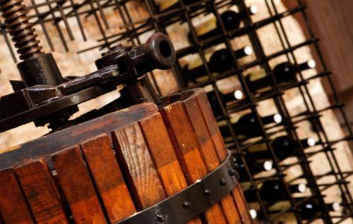 a bunch of wine bottles in a wine rack at Villa Urska in Bol