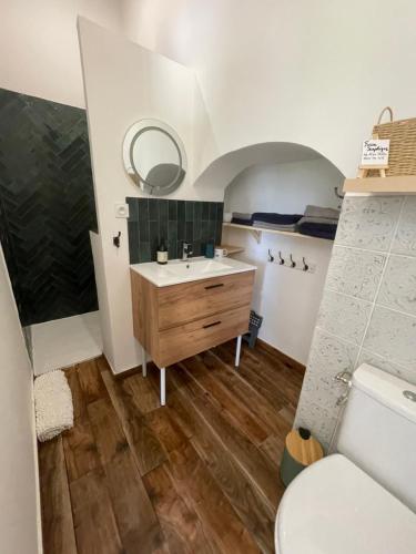 a bathroom with a sink and a toilet at Maison au cœur des bois Pich Home Serenity in Miramas