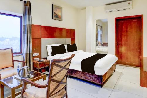 Ένα ή περισσότερα κρεβάτια σε δωμάτιο στο Townhouse JFN Comfort Hotel