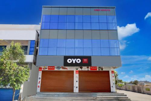an office building with a yes sign on it at Hotel O Nayati Grand in Hyderabad