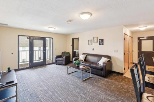 a living room with a couch and a table at Work Relax Repeat in a Bright and Spacious Stay in Mansfield