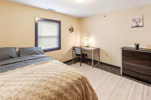 a bedroom with a bed and a table and a desk at Work Relax Repeat in a Bright and Spacious Stay in Mansfield