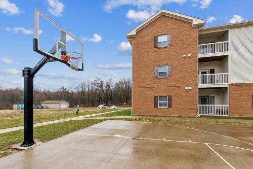 a basketball hoop in front of a building at Work Relax Repeat in a Bright and Spacious Stay in Mansfield