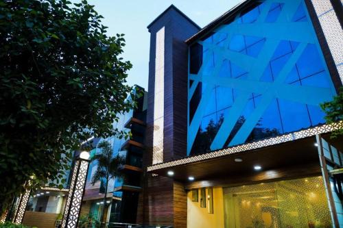 a building with blue glass panels on it at SK Premium Park GGN in Gurgaon