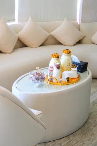 a coffee table in front of a couch at AL MARSA HOTEL APARTMENTS in Khor Fakkan