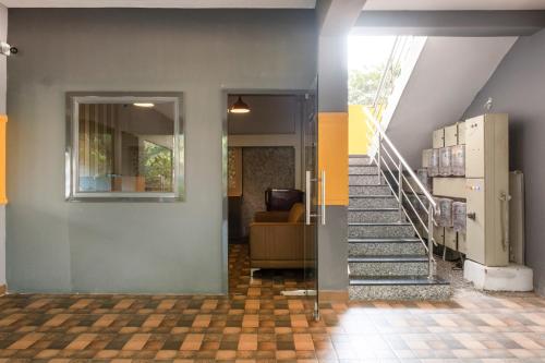 a staircase in a house with a lobby at Treebo Breeze Way, Rushikonda in Visakhapatnam