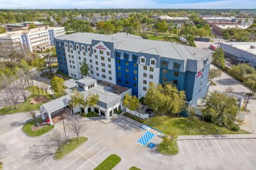 an overhead view of a building in a city at Hilton Garden Inn Houston Northwest in Houston