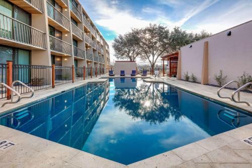 an image of a swimming pool at a hotel at Ramada by Wyndham Austin South in Austin