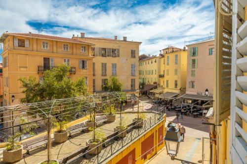 a view of a street in a city with buildings at Les Logettes 2 in Menton