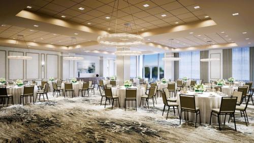 a banquet hall with tables and chairs in a room at Hilton Garden Inn Colorado Springs Downtown, Co in Colorado Springs
