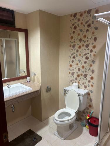 a bathroom with a toilet and a sink at Baan Klang Condo in Hua Hin in Hua Hin