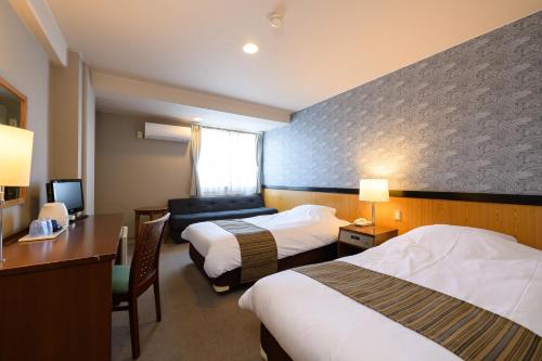 Postel nebo postele na pokoji v ubytování Hotel Asyl Nara Annex