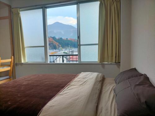 Postel nebo postele na pokoji v ubytování Easy Stay Chichibu