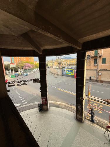 a view of a city street from a window at Hotel Fiumara in Genova