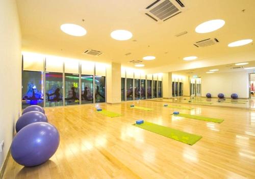 a gym with green mats on a wooden floor at Royal Strand Country Garden Danga Bay in Johor Bahru