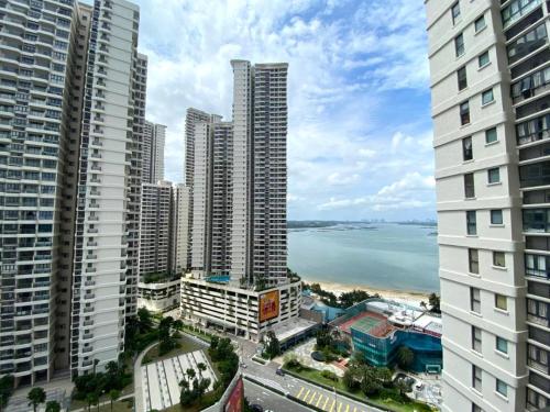 a view of a city with tall buildings and the ocean at Royal Strand Country Garden Danga Bay in Johor Bahru