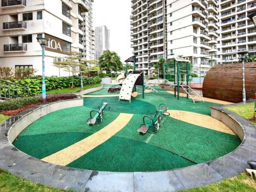 a playground with a slide in a park at Royal Strand Country Garden Danga Bay in Johor Bahru