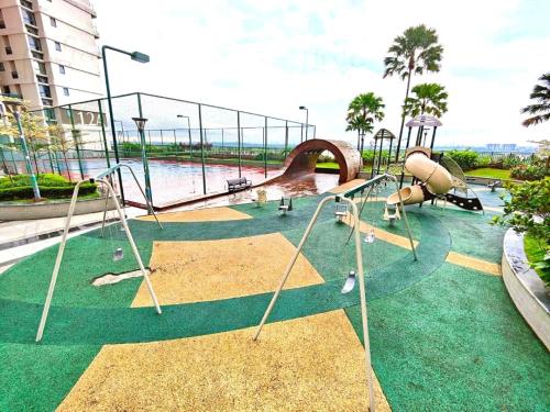 an empty playground with a slide and swings at Royal Strand Country Garden Danga Bay in Johor Bahru