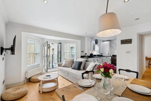 a living room with a couch and a table at Free parking - Villa Apartment - Hosted by StaySejour in Brighton & Hove