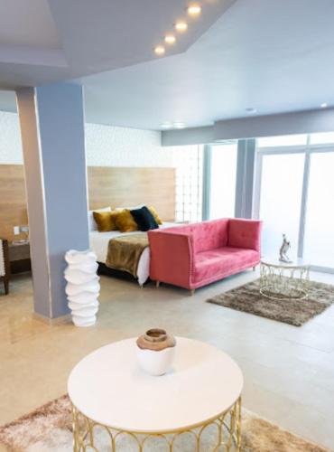 a living room with a couch and a table at Mantra Hotel Boutique in Santa Marta