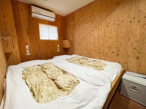 Giường trong phòng chung tại Guesthouse Otaru Wanokaze double room / Vacation STAY 32211