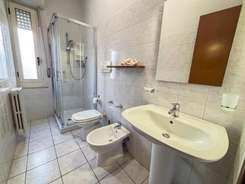 a bathroom with a sink and a toilet and a shower at La Conchiglia - Pineto Vacanza in Pineto