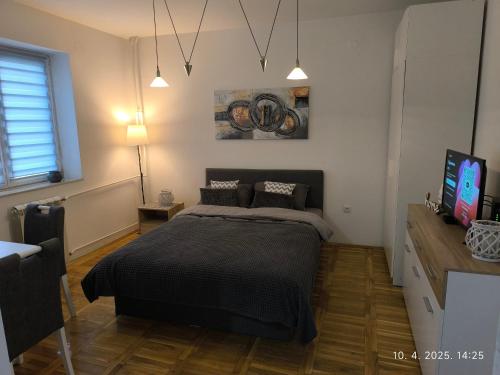 Postel nebo postele na pokoji v ubytování Marigold NS