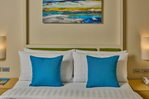 Cama o camas de una habitación en Savoy Hotel Boracay near Newcoast Beach