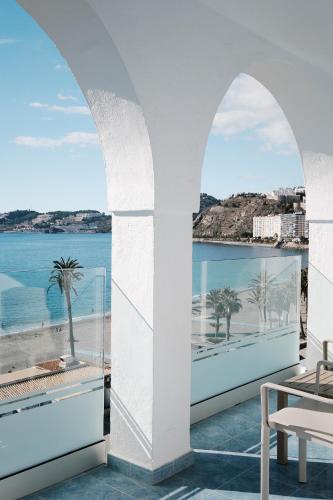 a view of the ocean from the balcony of a resort at Hotel Helios Costa Tropical in Almuñécar