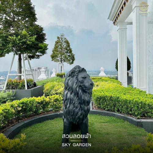 a statue of a lion in front of a building at 2 Bed Room Sea View Great Place in Jomtien Beach