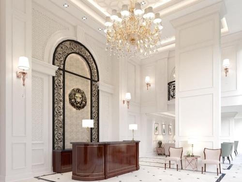 a lobby with a chandelier and a table and chairs at 2 Bed Room Sea View Great Place in Jomtien Beach