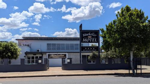 a building with a sign for a motel at Mackellar Motel in Gunnedah