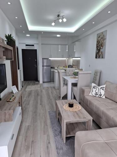 a living room with a couch and a table at Apartman Kamelia in Jagodina
