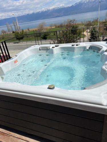 a jacuzzi tub with a view of the ocean at Toka Hotel Restaurant in Pogradec