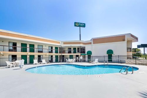 a pool in front of a hotel at Quality Inn Selma - Smithfield in Selma