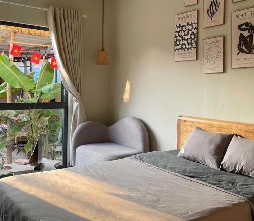 Postel nebo postele na pokoji v ubytování Homestay Nhà Trong Hẻm Đảo Phú Quý