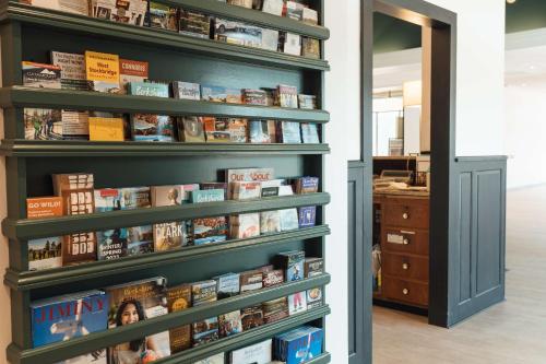 a book shelf filled with books in a room at Hotel Downstreet, an Ascend Collection Hotel in North Adams