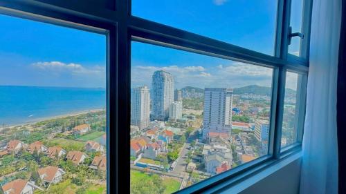 a view of a city from a window at Sóng Homestay-The Sóng Apartment Vũng Tàu Nghỉ Dưỡng Biển Cao Cấp 5 Sao- The Song Vung Tau Condotel 5 Star Beach View Apartment in Vung Tau