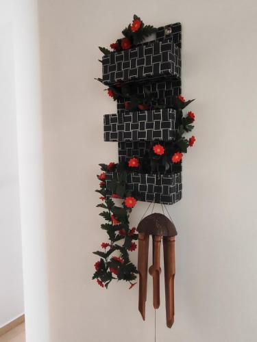 a wall with a brick wall with a bunch of flowers at Δροσιά in Nafplio