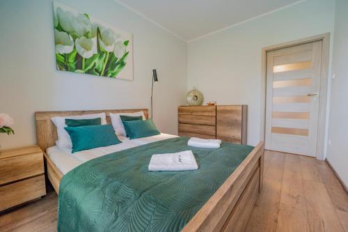 Posteľ alebo postele v izbe v ubytovaní Apartament w Cieplicach