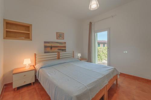 En eller flere senge i et værelse på Villetta Biodola Beach