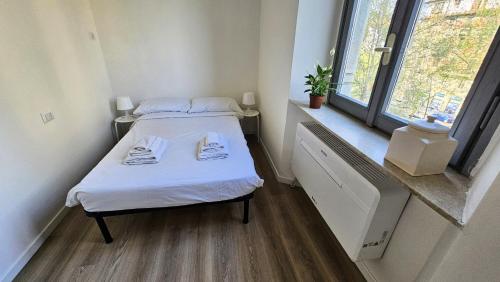 Letto o letti in una camera di Duomo a 8 min - Centro, Qc Terme, 2 camere