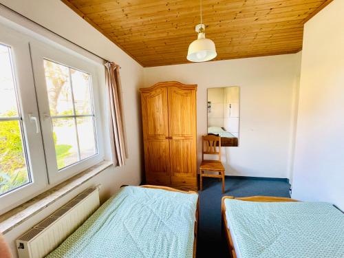 Ένα ή περισσότερα κρεβάτια σε δωμάτιο στο Ostsee Apartments Salzhaff