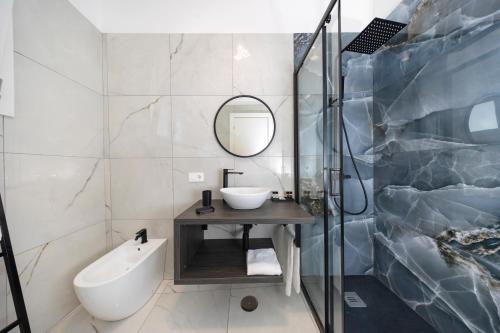 a bathroom with a sink and a mirror at A due passi in Capri